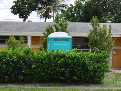 portable toilet at a home construction site